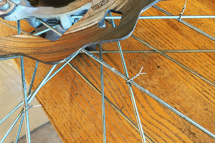 One huge trick that takes some of the wheel building skill out of the process is to use wire or zip-ties to wrap each spoke at the crossing point. This will keep spoke placement so you just drop the new rim right in place. 
