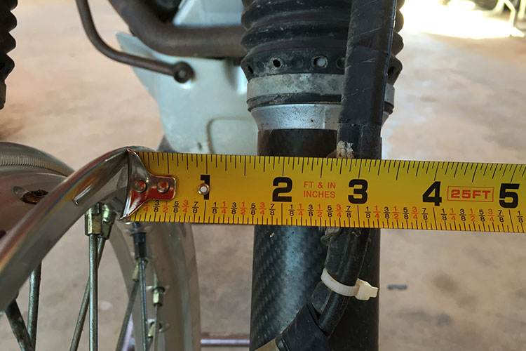 Measure to make sure you have the rim centered. Measuring before you disassemble isn't a bad thing to do either to make sure your wheel is centered, there are some bikes with slight offsets.